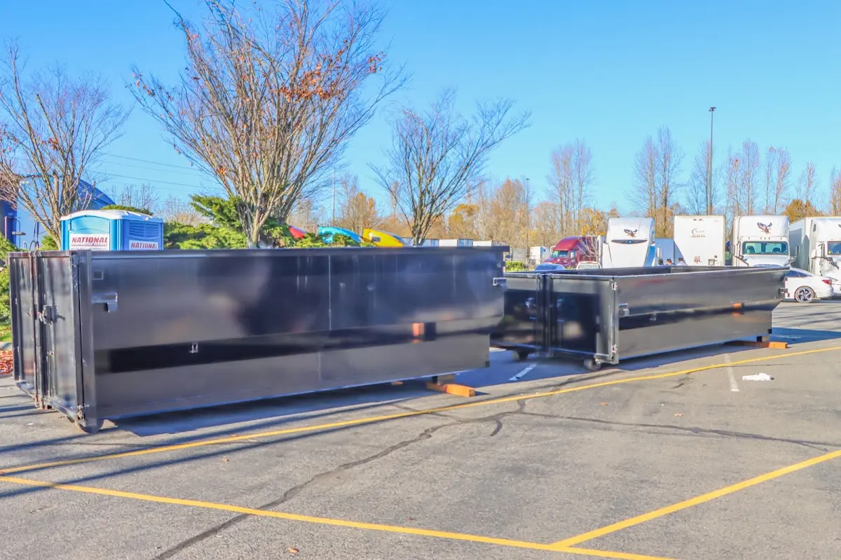 Professional dumpster rental service with roll-off container on residential driveway in Blythewood